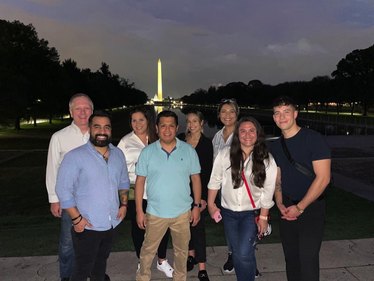 Latin American Group of DHL on Night Tour of the Reflecting Pool, Washington Monument and Capitol in June 2023