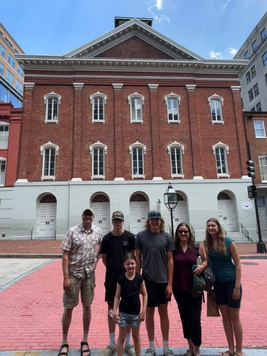 The Adams family from Silverdale, Washington are in front of Fords Theatre in July 2025