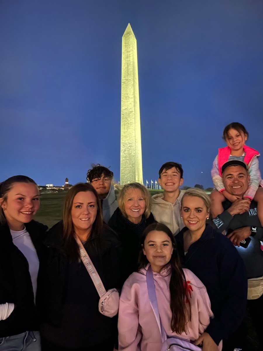 The Sanchez family from Austin, Texas at the Washington Monument at Night in March 2025